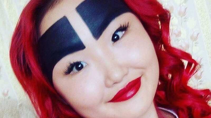 The young woman, known for significantly overdrawing her eyebrows, reached fame accidentally when an onlooker took a photo of her on the bus and shared it online (Image: Anzhelika Protodyakonova / CEN)