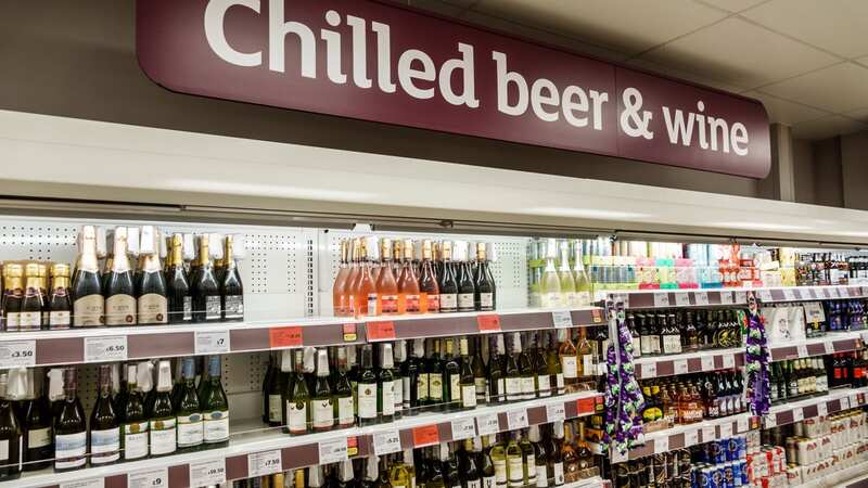 The locked cabinets are being trialled in the alcohol aisles of some stores (Image: Universal Images Group via Getty)