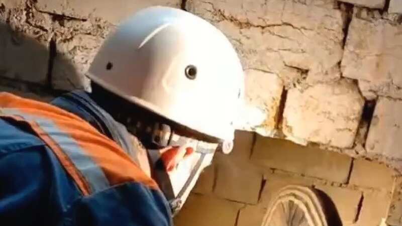 Moment woman who spent 3 days trapped behind basement wall is rescued