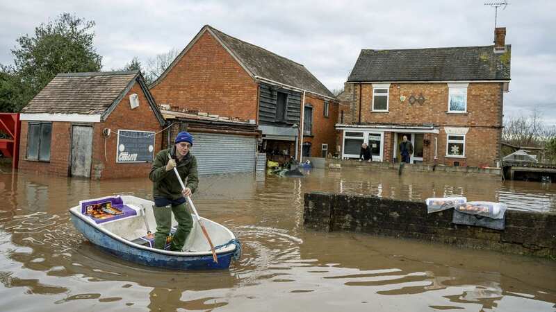 Flooding in Maisemore, Gloucestershire - a scene that is likely to become more common in the future (Image: SWNS)