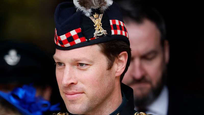 King Charles with Lieutenant Colonel Johnny Thompson as he addresses Parliament (Image: Getty Images)