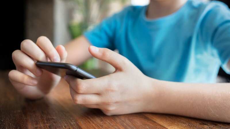 Parents may wonder when the right time is for their child to have a mobile phone (Image: Getty Images)