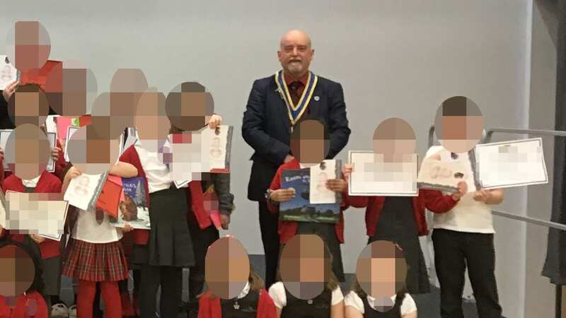 Convicted paedophile Marc Sherland appearing at a school poetry competition as president of the Robert Burns World Federation