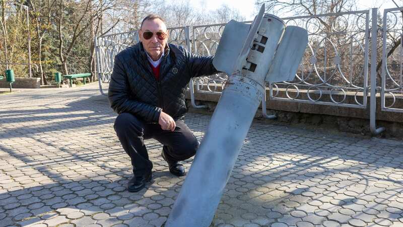 Mykolaiv Zoo director Volodymyr Topchy with the rocket which hit the attraction (Image: Tim Merry/Mirror Express)