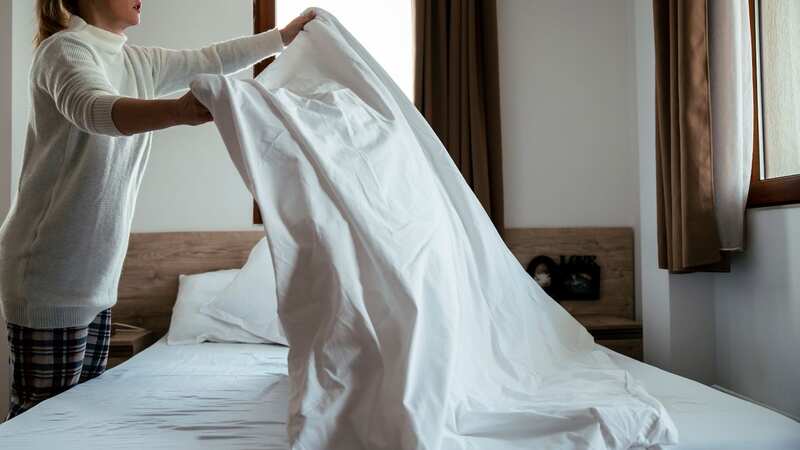 A woman is concerned she is not washing her bedding enough after hearing people wash their pillow cases, duvet cover, and sheets every week (Image: Getty Images/iStockphoto)