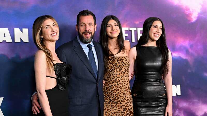 Adam Sander posed with his wife and their daughters (Image: Variety via Getty Images)