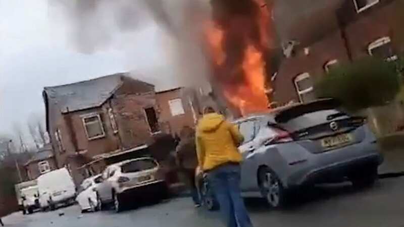 Gas explosion as primary school evacuated and woman, 70, seriously injured