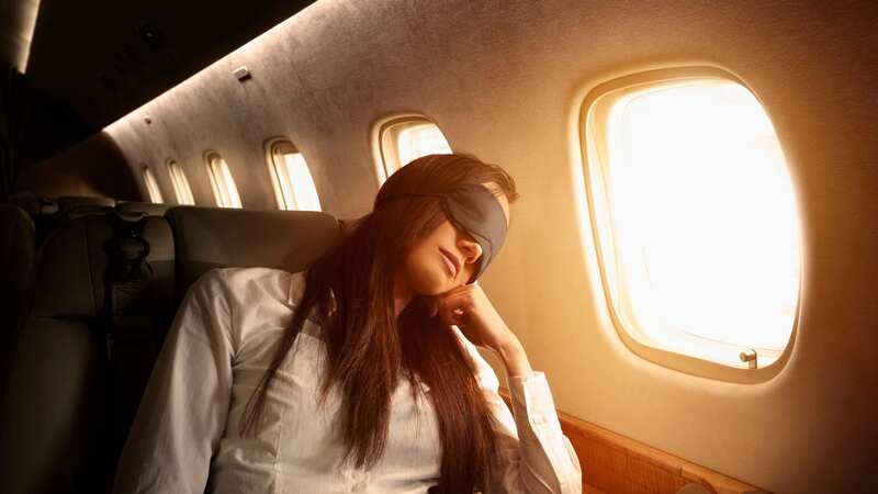 There are safer ways to get some sleep during a flight (Image: Getty Images)