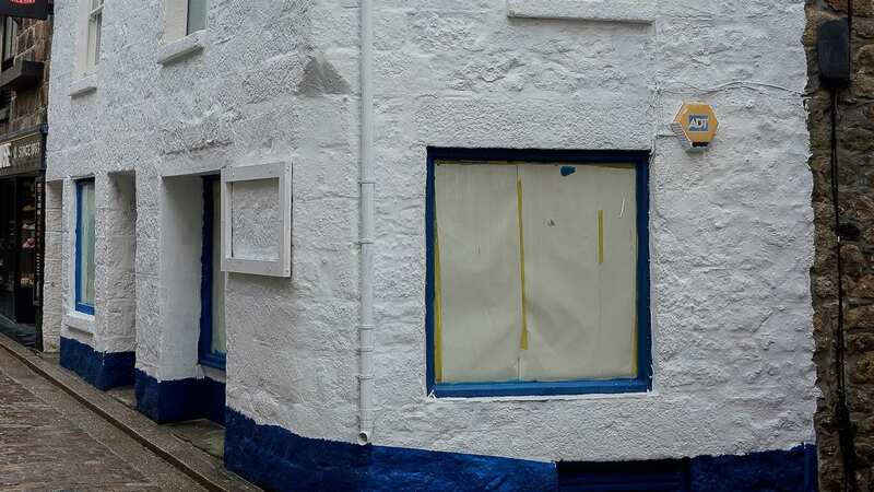The shop in St Ives, Cornwall, has recently been painted white again after the outcry (Image: SWNS)