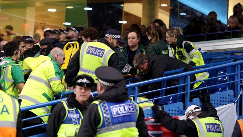 A Leeds fan received treatment after falling from the upper tier at Stamford Bridge (Image: GLYN KIRK/AFP via Getty Images)