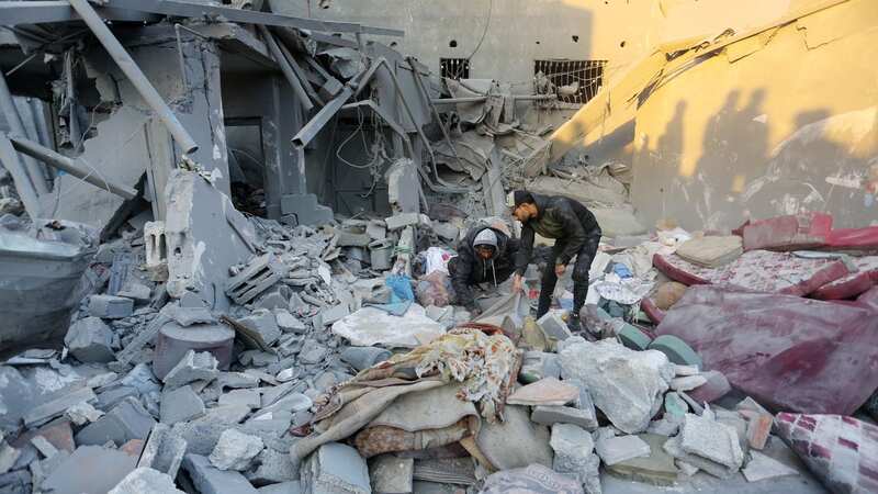 Local residents conducted a search and rescue operation among the rubble following a previous airstrike yesterday (Image: Anadolu via Getty Images)