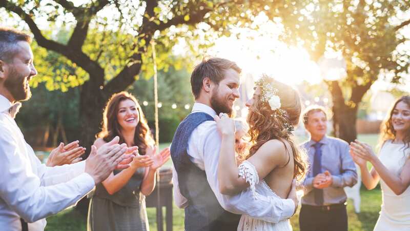 The bride was praised for refusing to change her wedding date. (Stock Photo) (Image: Getty Images/iStockphoto)