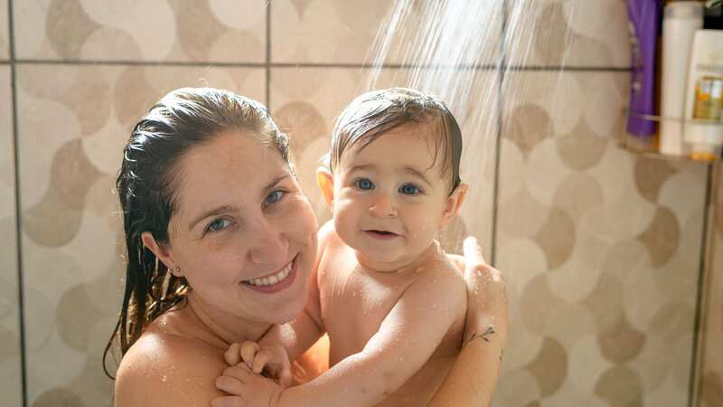 A mum-of-four says she showers with her children to 