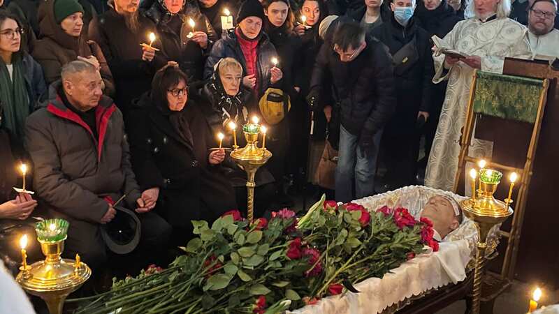 The body of Alexei Navalny is seen in an open casket during his funeral today (Image: AP)