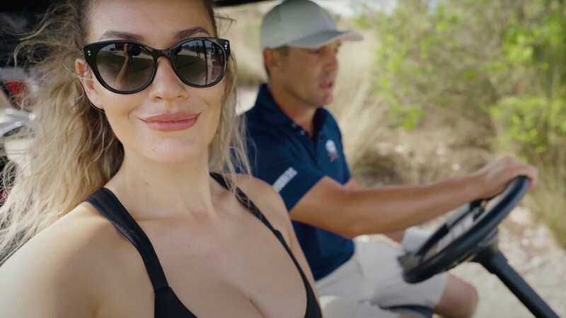 Paige Spiranac had Bryson DeChambeau drive her around the course in a buggy during the match (Image: @ Paige Spiranac/Youtube)
