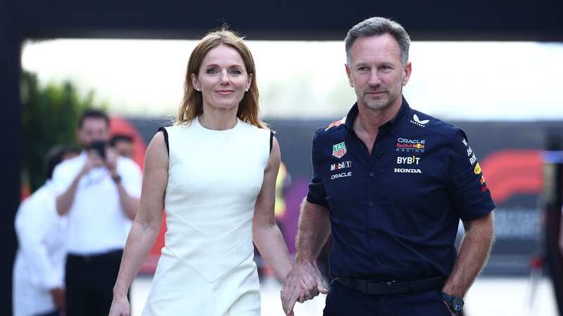 Bull Racing Team Principal Christian Horner and Geri Horner walk in the Paddock holding hands (Image: Getty Images)