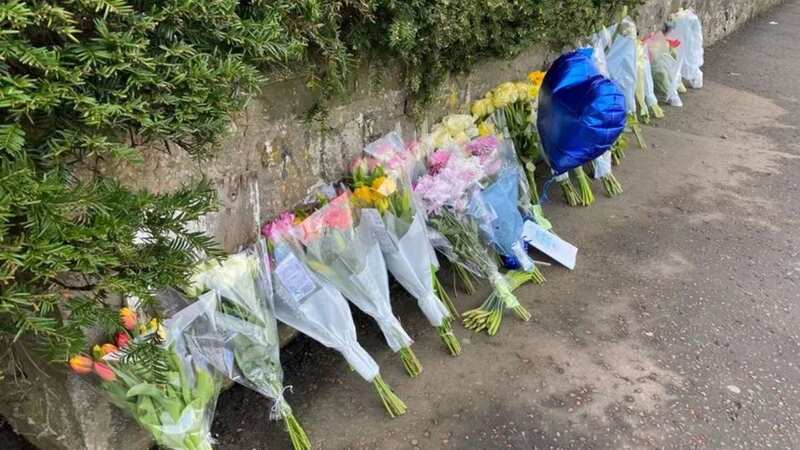 Flowers and cards with poignant messages have been left at the scene of the collision (Image: Edinburgh Live)