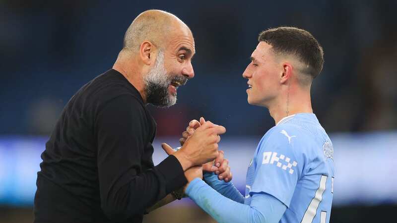 Manchester City boss Pep Guardiola and Phil foden (Image: James Gill - Danehouse/Getty Images)
