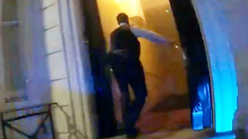 Moment police kick down door of burning building to rescue terrified residents