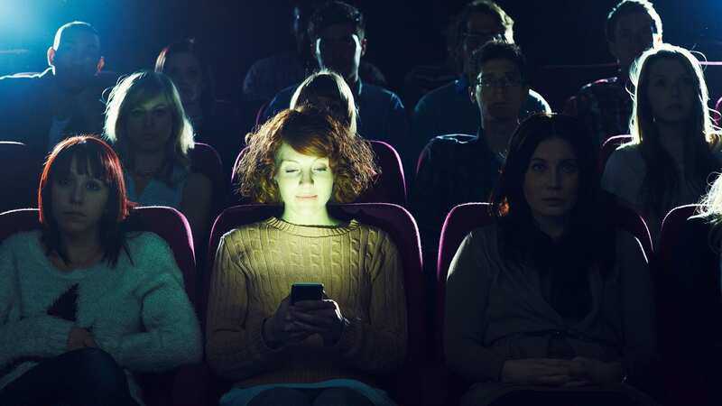 Is there anything more annoying than someone using a phone in the cinema? (Image: Getty Images)