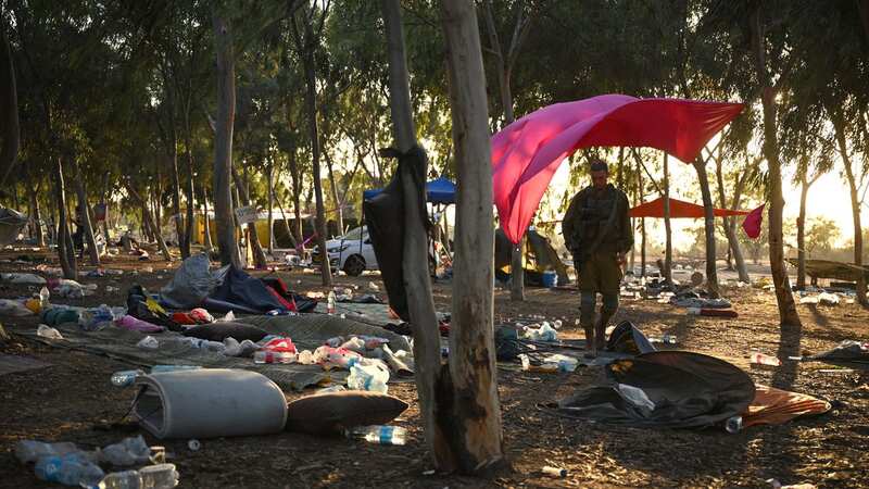 Israeli soldiers search among the tents at the Supernova Music Festival site in Kibbutz Reim, Israel (Image: Getty Images)