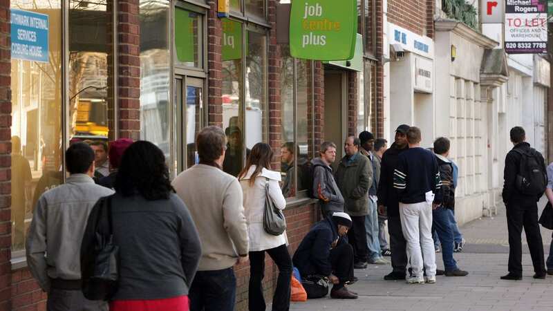 Job seekers queue outside a Jobcentre Plus branch in London (Image: Getty Images)