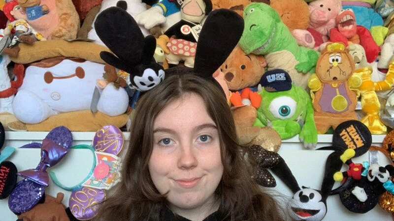 Kerri with her Disney collection (Image: Kerri Carter/SWNS)