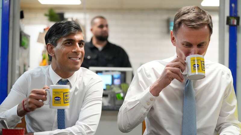 RIshi Sunak and Jeremy Hunt visited a building supplies warehouse after the Budget (Image: PA)