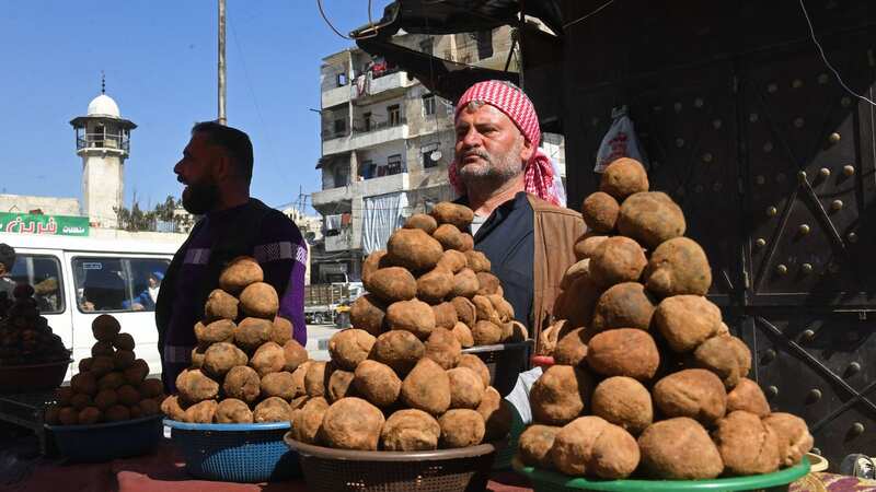 Syrian vendors selling truffles at a market in Aleppo (Image: AFP via Getty Images)