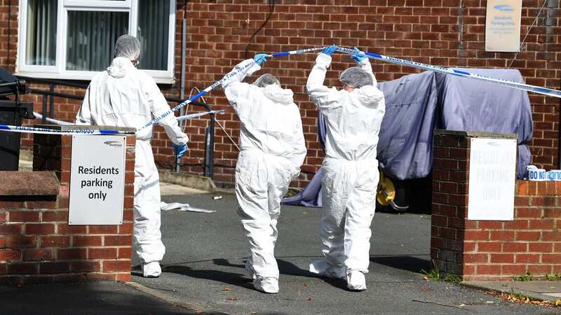 Forensic officers at the scene of the alleged murder (Image: Liverpool Echo)