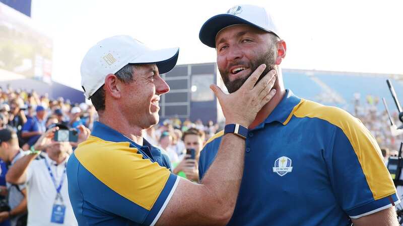 Rory McIlroy and Jon Rahm shared an embrace as Team Europe celebrated following victory at the 2023 Ryder Cup at Marco Simone Golf Club (Image: Getty)