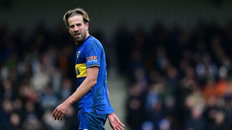 AFC Wimbledon midfielder Harry Pell has been charged with misconduct (Image: Mike Hewitt/Getty Images)