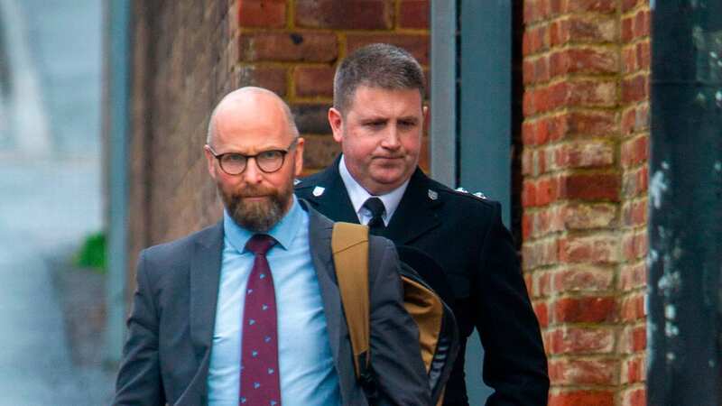 Inspector Darren Lane (right) walks out with his lawyer on Monday at Sussex Police HQ (Image: David McHugh / Brighton Pictures)