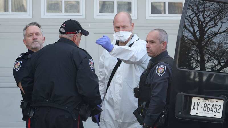 Investigators at the scene in the Barrhaven suburb of Ottawa (Image: Canadian Press/REX/Shutterstock)