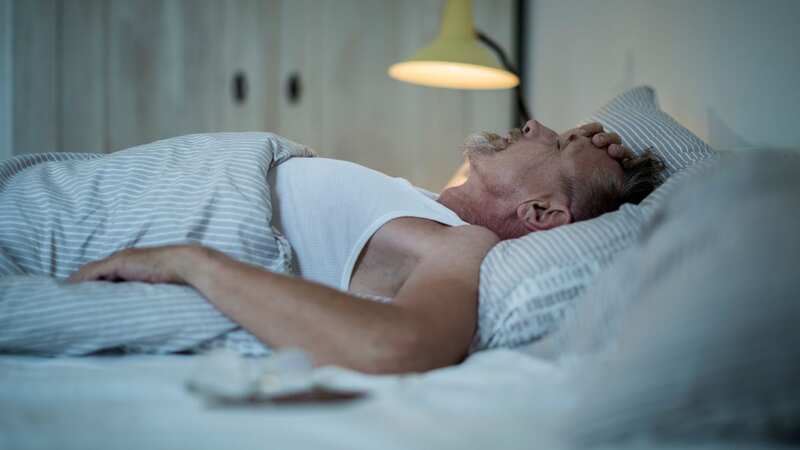 Sweats upon waking up can mean many things, but can be an early sign of cancer when paired with other symptoms (Image: Getty)