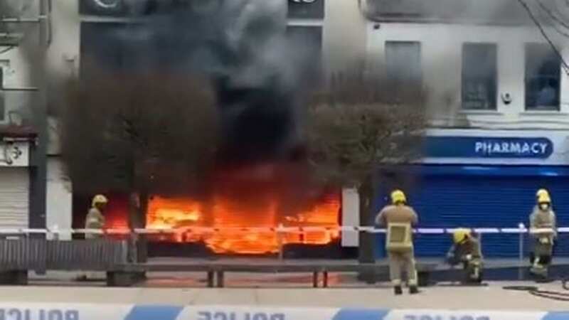 Huge shop explosion sees fireball erupt as firefighters take cover from blaze