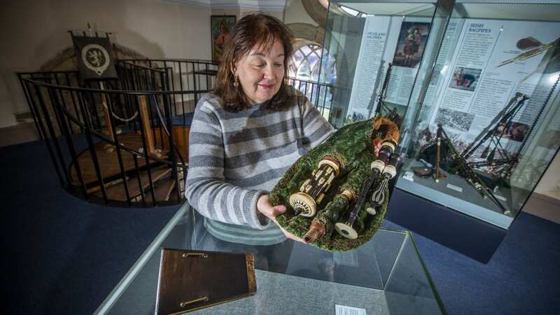 Anne Moore with what is believed to be the oldest bagpipes in the world (Image: SWNS)