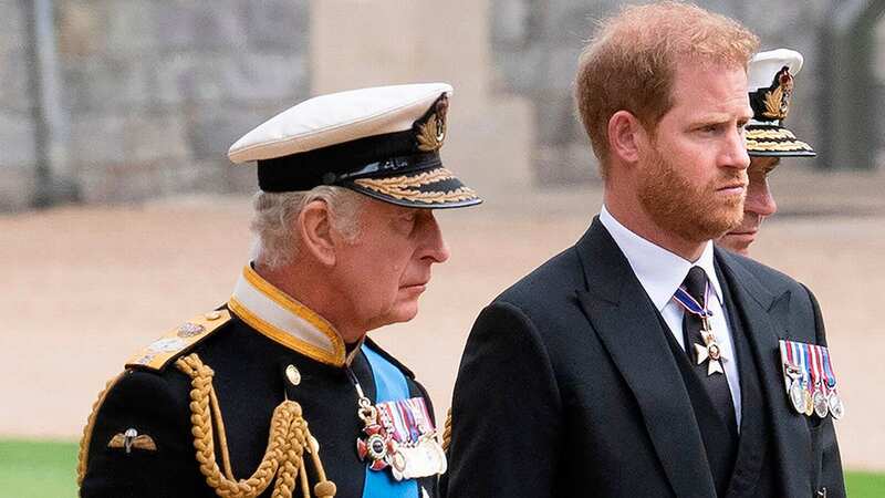 Prince Harry with his father King Charles (Image: Getty Images)