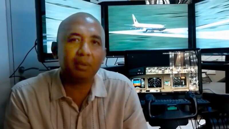 Flight MH370 captain Zaharie Ahmed Shah with his home aircraft simulator (Image: YOUTUBE)