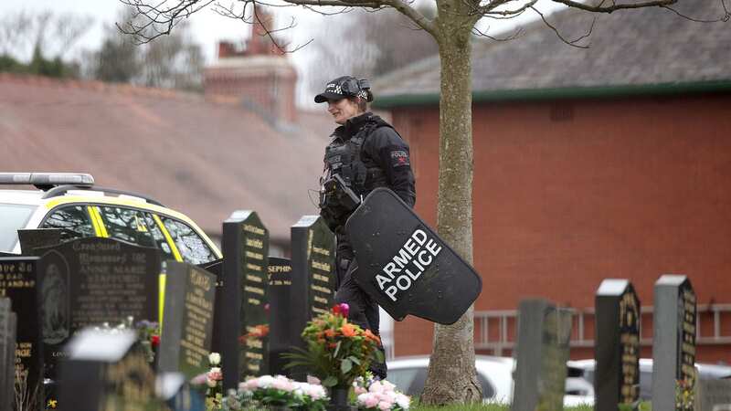 Armed police at Hurst Cross Cemetery (Image: MEN Media)