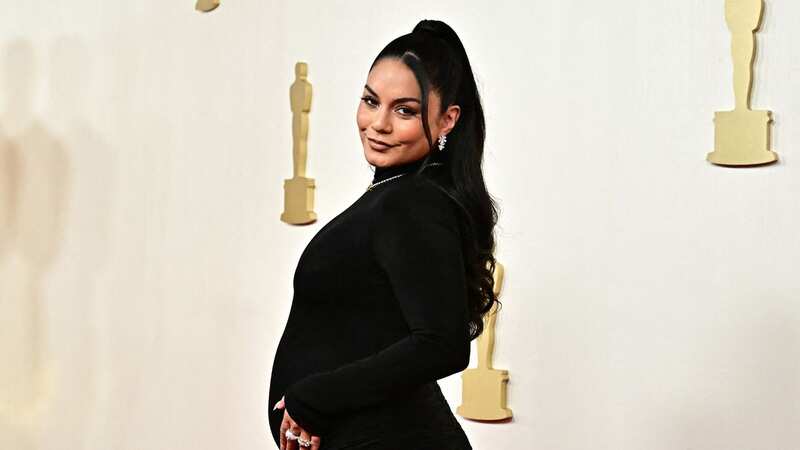 Vanessa Hudgens announces pregnancy as she cradles bump on Oscars red carpet (Image: AFP via Getty Images)