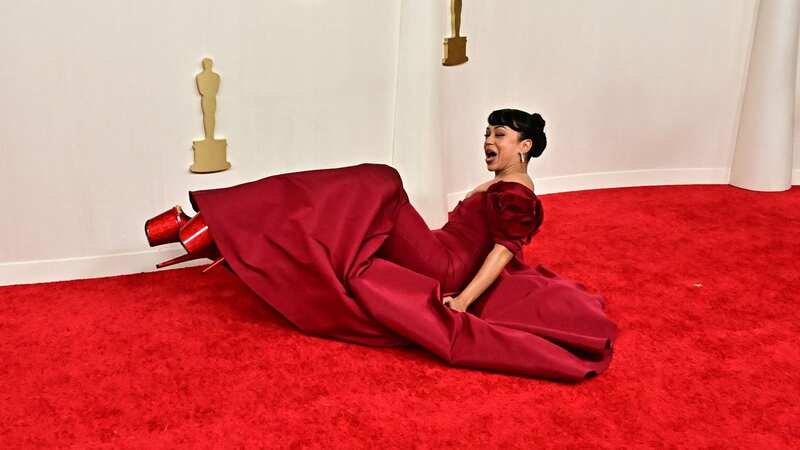 Liza Koshy fell on the Oscars red carpet (Image: AFP via Getty Images)