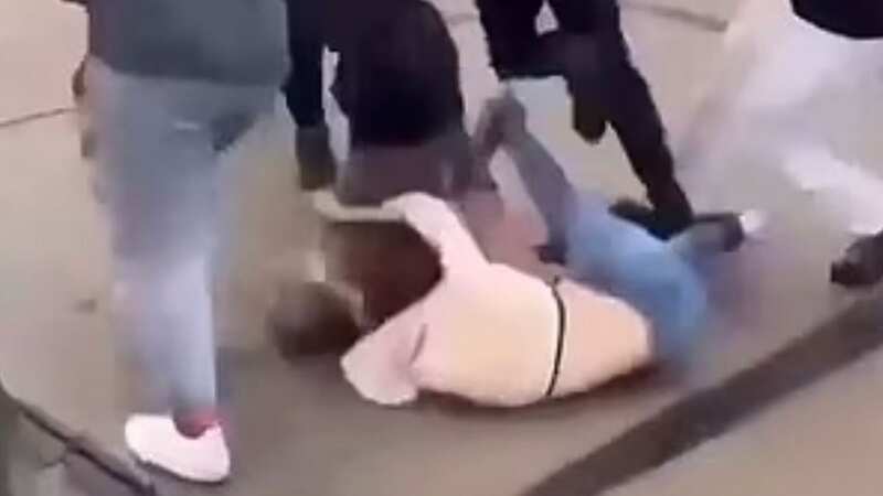 The suspect throws the victim on the ground and strikes her repeatedly (Image: Twitter)