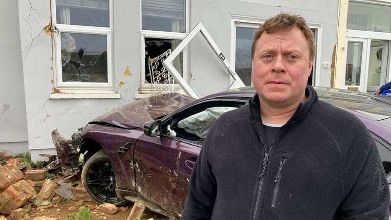 Michael Jacobs received a call from his wife telling him a BMW had smashed into their house while she and their baby were inside (Image: KMG)