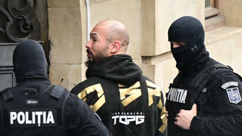 Andrew Tate arrives at court in Romania on Tuesday (Image: AFP via Getty Images)
