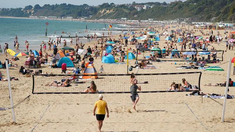 It may be warm enough to enjoy a beach this week - if the rain holds off (Image: PA)