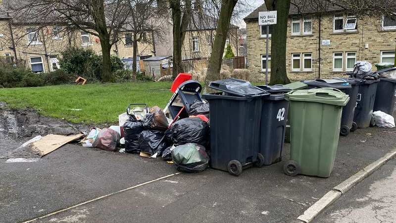 Piles of black bin bags blight the cul-de-sac in Huddersfield (Image: Huddersfield Examiner)