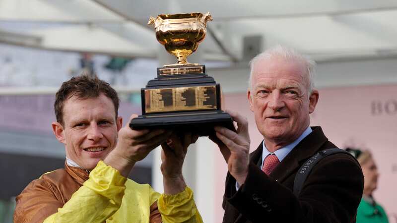 Paul Townend and Willie Mullins hold the trophy after victory with Galopin Des Champs in the Gold Cup in the 2023 Cheltenham Festival (Image: Getty Images)