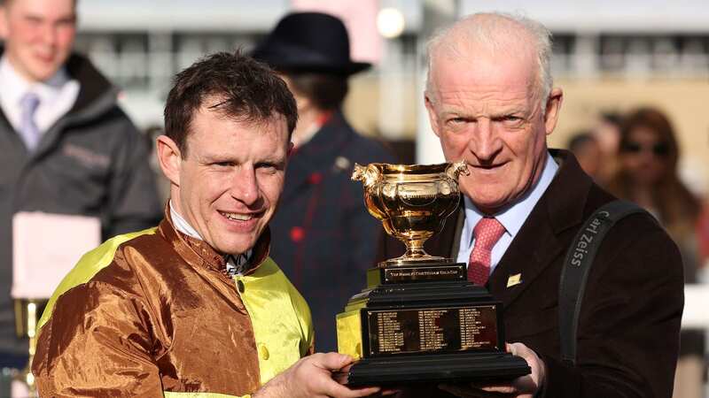 Paul Townend and Willie Mullins hold the trophy after victory with Galopin Des Champs in the Gold Cup in the 2023 Cheltenham Festival (Image: Getty Images)