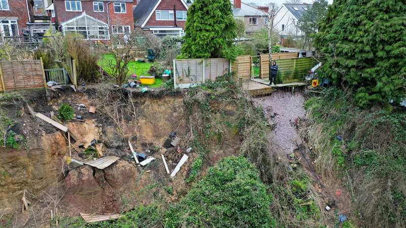 John Hingley says a landslip at the rear of his house is moving rapidly (Image: Express & Star/SWNS)